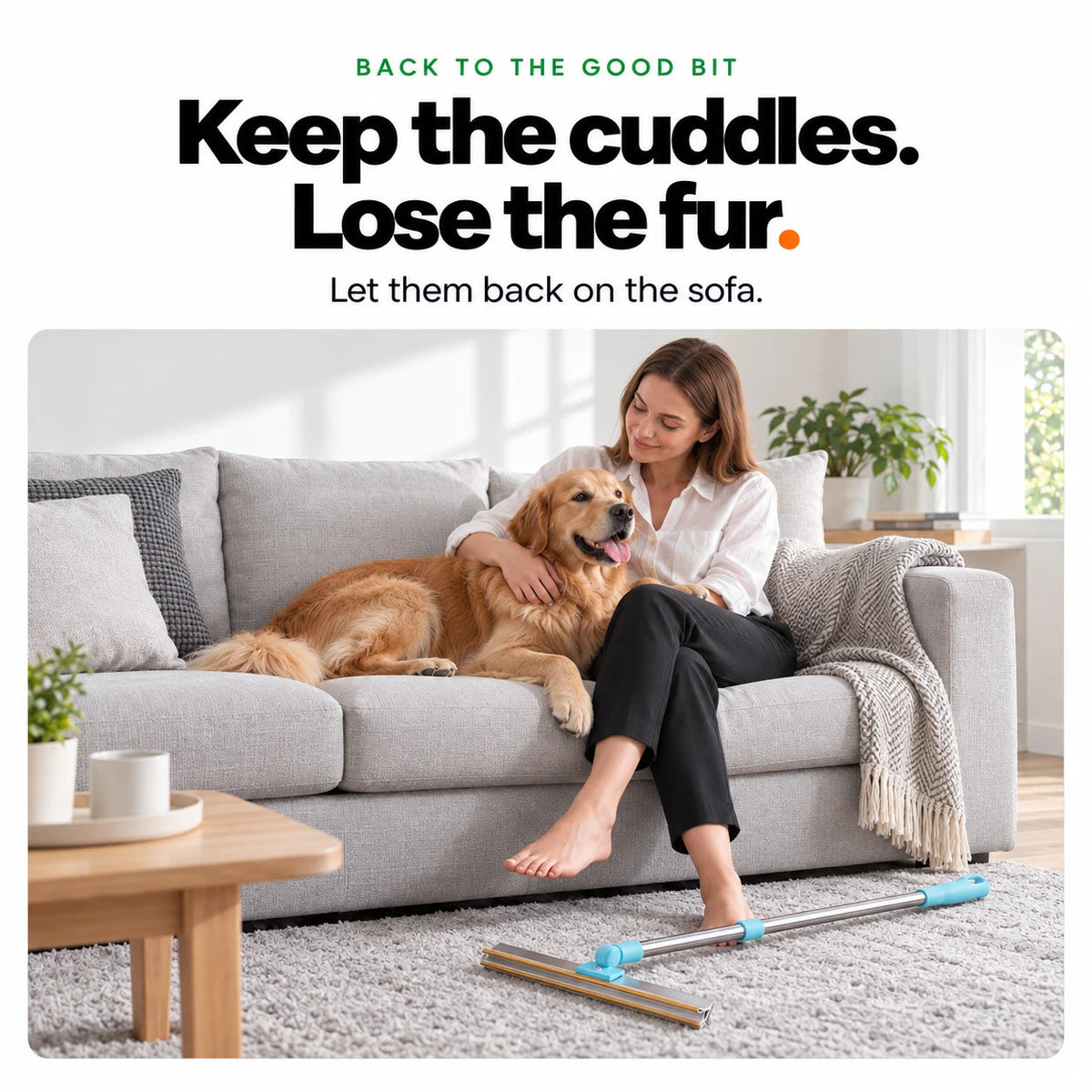 A woman cuddling her golden retriever on a fur-free sofa, the rake on the rug