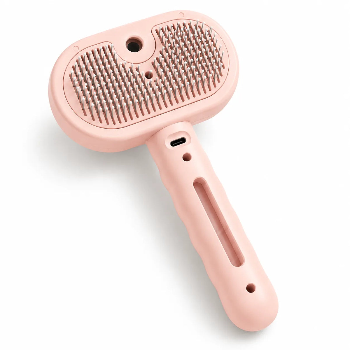 Meoggy Mist Comb detangling spray brush for cats and dogs in pink, with rounded bristle tips and a water mist outlet